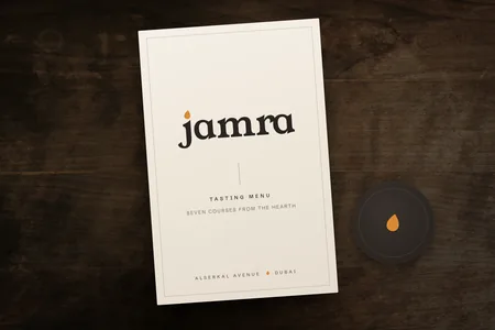 The new Jamra logo on a tasting menu cover